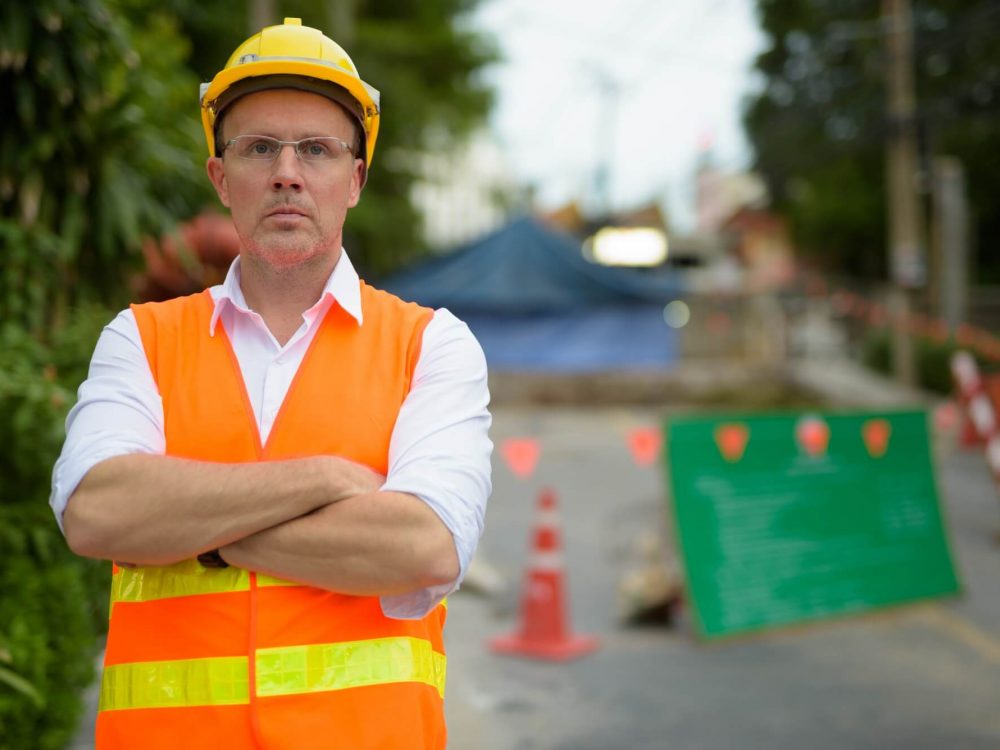 mature-man-construction-worker-at-the-construction-site-in-the-c-2.jpg